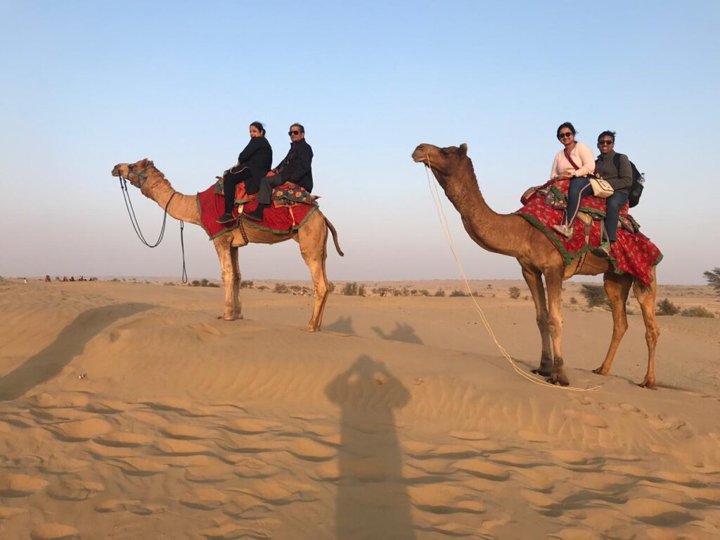 tourist on camel in desert